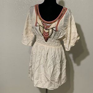 White dress with colorful beads